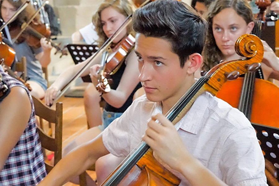 REHEARSALS FOR WORLD STAGE. Senior Giacomo Glotzer plays with the Chicago Youth Symphony Orchestra in the Czech Reupublic this summer. After months of rehearsing, he traveled to three European countries with the orchestra.