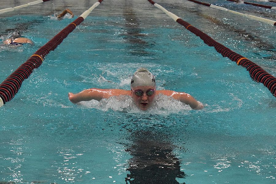 MAKING WAVES. Senior Anna Peterson races through the pool at the UIC Natatorium. She com- petes for the Chicago Wolfpack Aquatic Club, and is ranked 20th in Illinois for her age group.