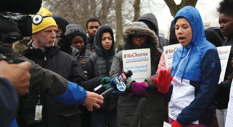 NOT JUST FOR THE RICH. Tina Brown, a student at Robeson High School, talks to reporters Jan. 24 on the Midway Plaisance. She and other protesters gathered outside of Blaine Hall to bring attention to the underfunding of public schools in Englewood. The demonstration was aimed at Mayor Rahm Emanuel to say that students in public schools want the same opportunities as his children who attended the Lab Schools.