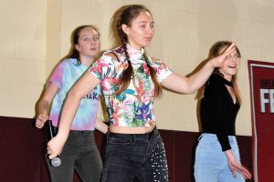 PROMOTING PIPPIN. Senior Katya Edwards, front, and sophomores Caroline Taylor and Joana Rose dance a preview of spring musical “Pippin” during Labapalooza, an alternative to Spring Fling, April 14. 