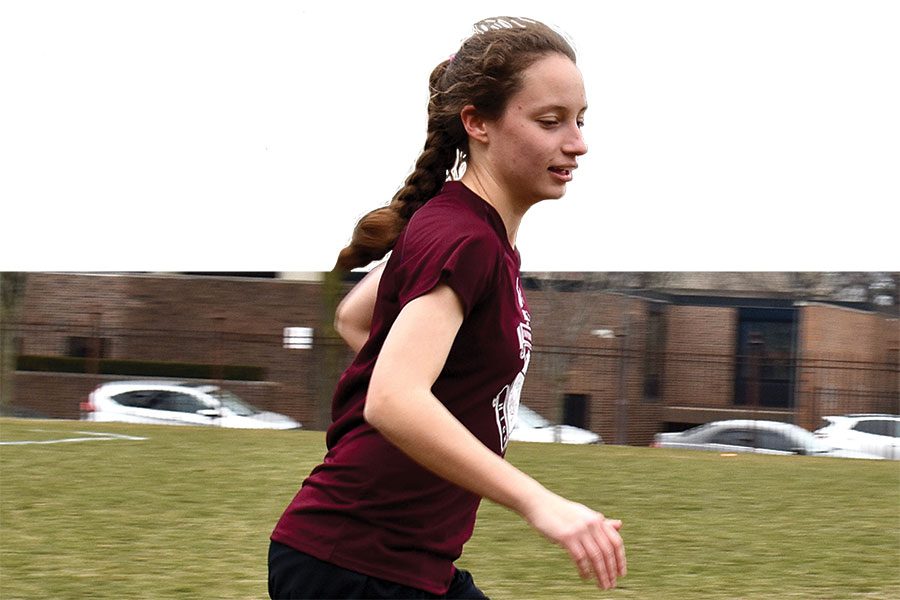SOCCER STAR.  Captain Anna Kenig-Ziesler dribbles a ball down Jackman Field during practice. In her fourth year as a varsity girls soccer player, Anna has high hopes for a strong showing at state, with the chance to win U-High’s first state title.