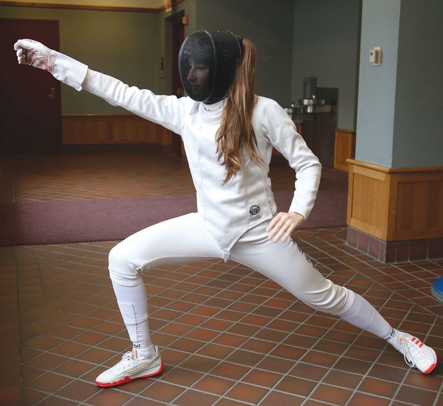 READY TO SPAR. Sarah Lurye practices her fencing stance. Sarah has been fencing with Windy City Fencing for eight years, and is ranked sixth in the nation for fencers under age 17. Her fencing career, under normal circumstances, takes her around the world.