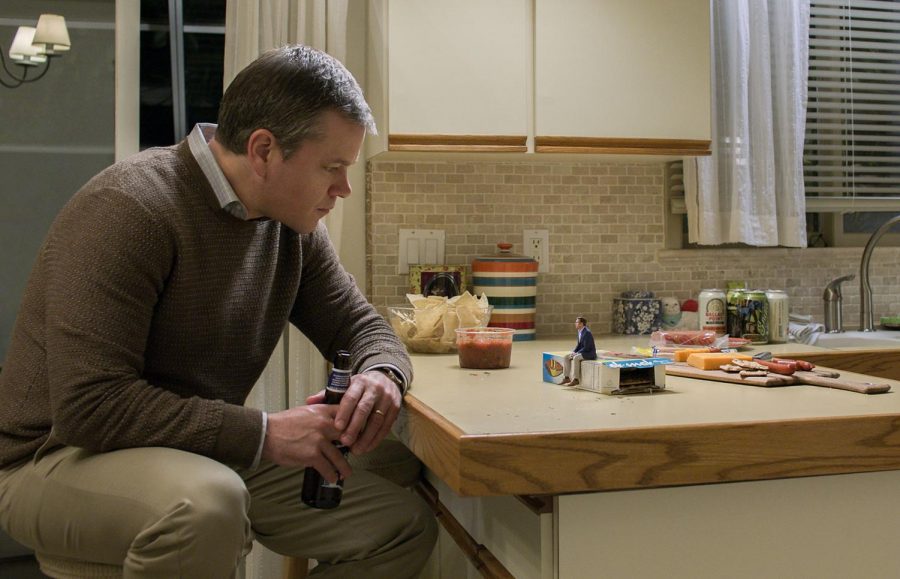 SHRINKING SMALL. Paul Safranek, played by Matt Damon, leans down to talk to his friend Dave Johnson, Jason Sudeikis, about the benefits of downsizing. In the movie, the process of downsizing was created as a solution to the climate change crisis, but the movie also includes character exploration and a comedic outlook.    