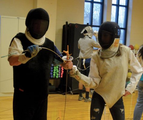 BEND, DON’T BREAK. Head coach Bakhyt Abdikulov works with a fencer at an afternoon practice. Mr. Abdikulov has been coaching for nearly 25 years, internationally and in the United States.