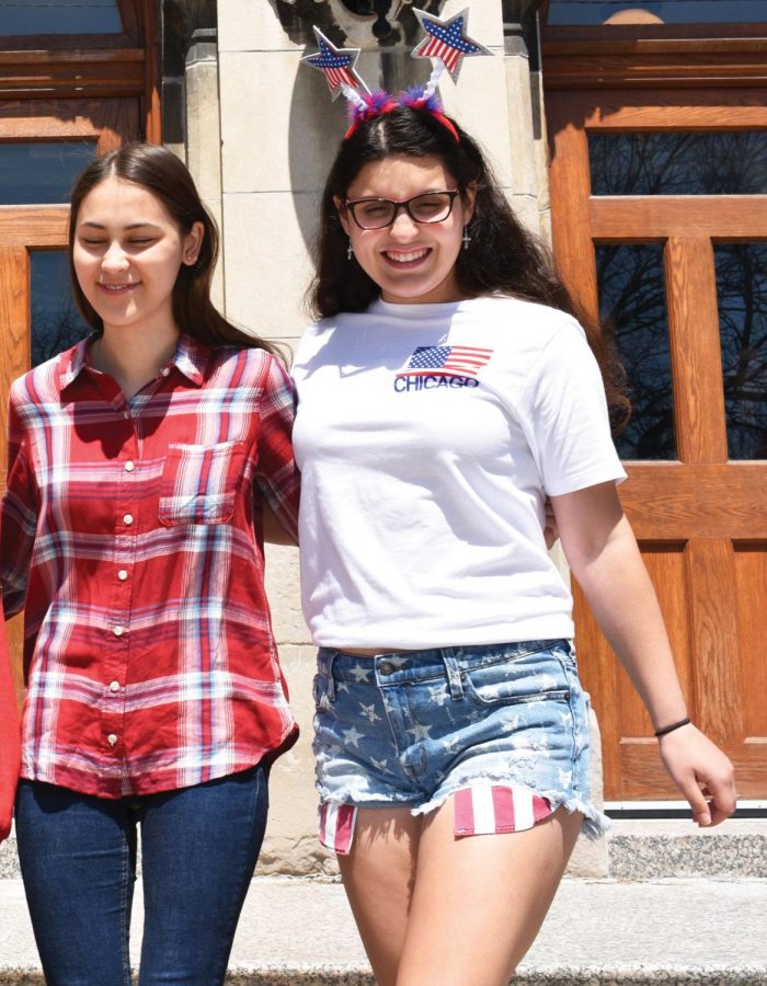 AMERICAN DAY. Seniors Chantalle DuPont and Miranda Meija exit Blaine lobby on April 30, which was American day for the Class of 2018. In their last week before leaving for May Project,  the Senior Class participated in beach day on May 2,  grade T-shirt day on May 3, and college T-shirt day on May 3. Seniors return from May Project on May 31 for presentations and an award assembly.