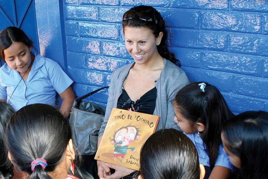 READING AND WRITING. Debra Gittler reads to students at San Jorge School in rural El Salvador. ConTextos, Ms. Gittler’s organization, originated in El Salvador.