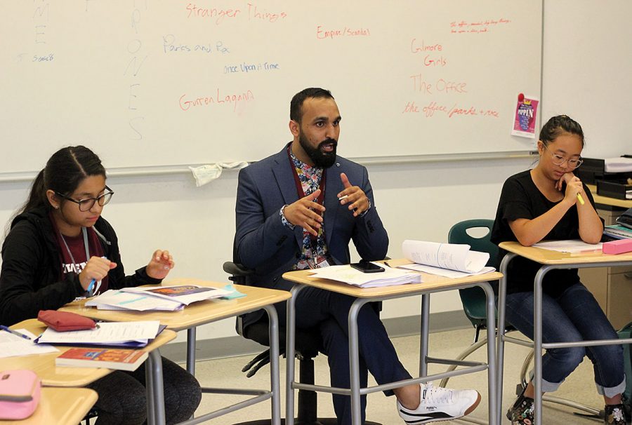 LITERARY LEARNING. New English teacher Hasham Bhatti speaks to a freshman class. This year’s new faculty members represent more people of color than in past years.