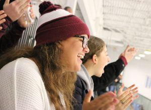 LAB PRIDE. Junior Gabriella Gruszka cheers on the Latin boys hockey game at Johnny’s Icehouse to support U-High classmates Nicholas Beach, Karan Gangwani and Grant Fishman Oct. 27. The Latin School team is made up of students from different schools around the city. Despite living far from the rink, Gabby has been to four games so far this season and has encouraged her friends to go, too. 
