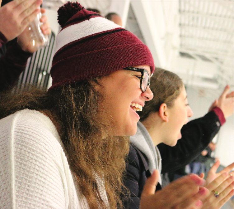 LAB PRIDE. Junior Gabriella Gruszka cheers on the Latin boys hockey game at Johnny’s Icehouse to support U-High classmates Nicholas Beach, Karan Gangwani and Grant Fishman Oct. 27. The Latin School team is made up of students from different schools around the city. Despite living far from the rink, Gabby has been to four games so far this season and has encouraged her friends to go, too.