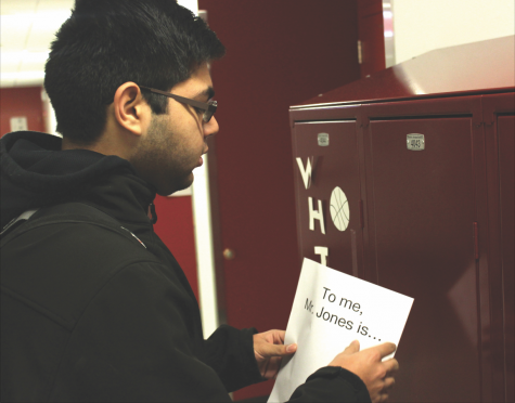 SUPPORTING FORMER FACULTY. Senior Sohil Manek hangs a poster to support science teacher Daniel Bobo-Jones, who was terminated Jan. 8. Alex Stevanovich, a senior who helped organize the show of support, said, “I wanted to say, ‘Hey Mr. Jones, we appreciate you.’”
