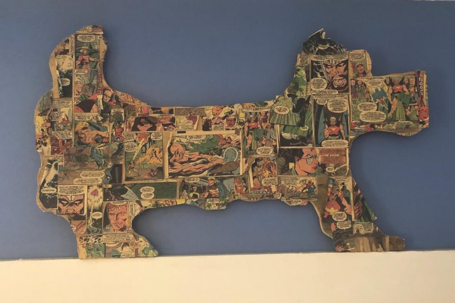 STOLEN STREET ART. Street artist Crave leaves his art around the Hyde Park neighborhood in hopes that people will take it home. Pictured above is cardboard Hyland Terrier made by Crave in Sophomore Amanda Cassel’s home, found around the neighborhood.