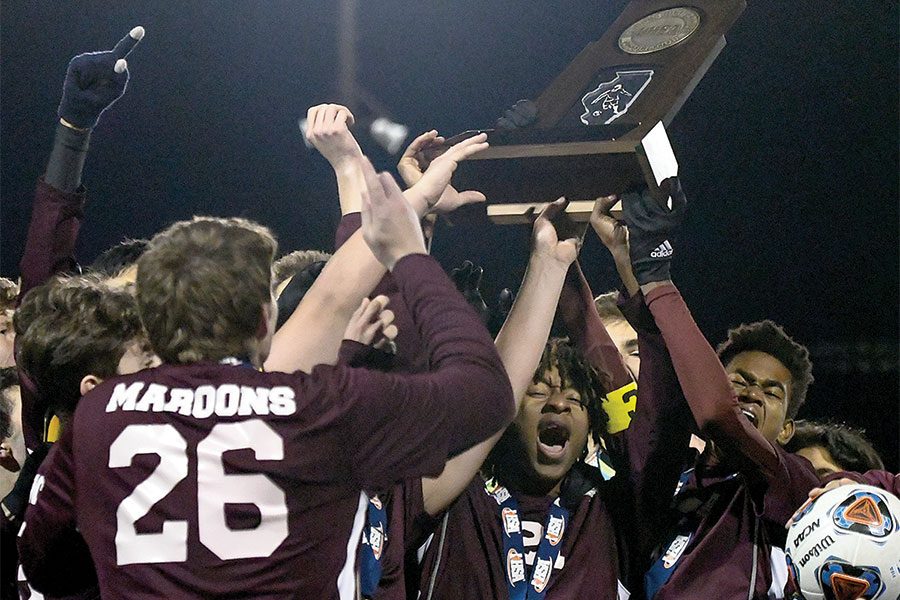 SNAGGING+THE+STATE+TITLE.+The+boys+soccer+team+celebrates+after+winning+state+final+game+against+Marquette+Catholic+High+School+2-1+on+Nov.+2.+After+being+down+a+goal+in+the+first+half%2C+the+Maroons+answered+with+goals+from+Stanley+Shapiro+and+Alex+Bal.+In+the+semifinal+game+Nov.+1%2C+the+Maroons+beat+North+Shore+Country+Day+School+3-0.
