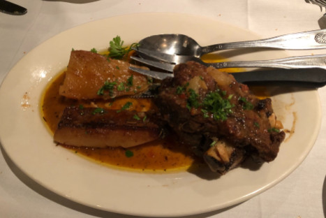 This dish is arni fournou (lamb loin with potatoes), served at Greek Islands in the West Town neighborhood.  Greek Islands has a transporting atmosphere and good authentic food for a fair price.