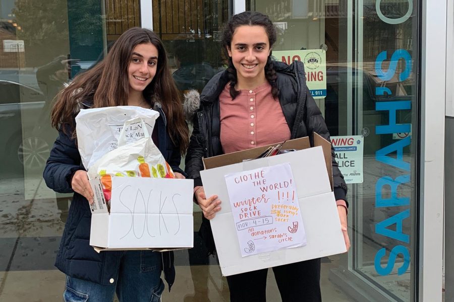 SERVICE SUPERSTARS. Sisters Adrianna and Alexandra Nehme drop sock donations from U-High club Clothe the World at Sarahs Circle, a nonprofit that supports women in need in Chicago.