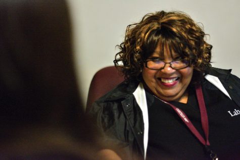 SMILING HARD. With a smile on her face, community service officer Cynthia Boykin warmly greets a student into Judd. Ms. Boykin has workws at Lab for eighteen years and is planning to retire soon. Every morning she greets students and adults with conversations and music to start the day.