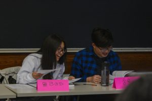 LEARNING BY SPEAKING. Eliza Doss works with 2019 U-High graduate Ryan Lee in a Korean class at the University of Chicago. Students attend the class five days a week to learn their heritage language.