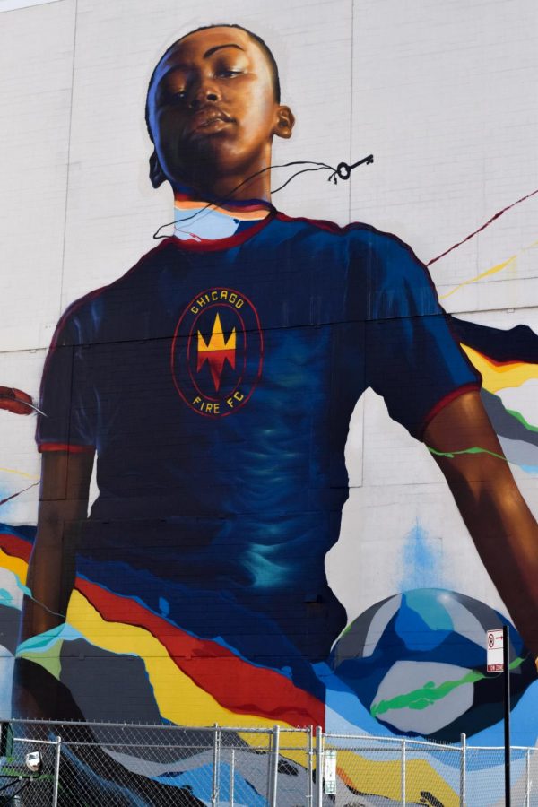 STAND FOR CHICAGO. An 80-foot tall mural looms over the British International School soccer field in the South Loop on the back of the Roosevelt Collection. The artist, Max Sansing, sought to “represent Chicago youth” with his artwork. According to the Fire, the mural will stay up for at least three years.