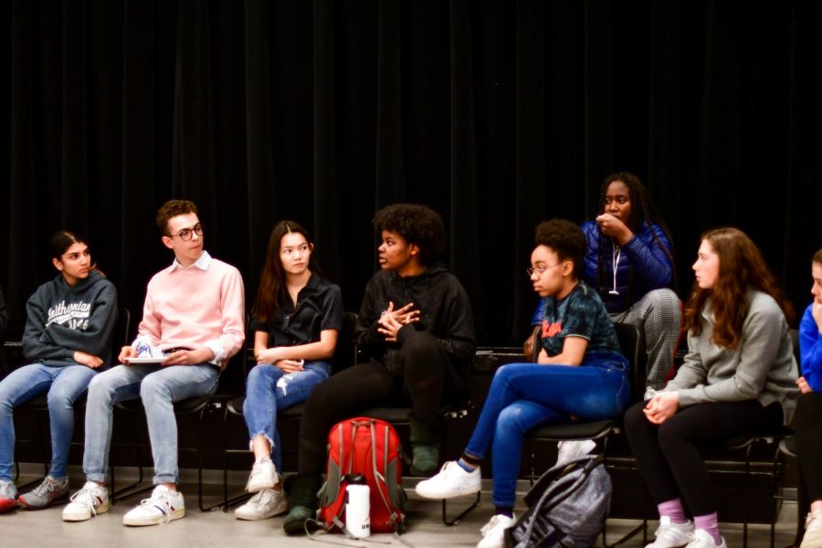 Senior Leah Runesha speaks while students listen during the open forum March 11 that discussed the recent racist incident. Students proposed steps the community can make to prevent these incidents in the future.