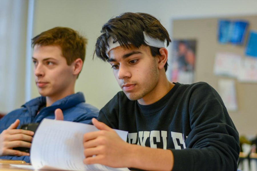 Juniors Rohan Shah and Loren Pope listen during a Mock Trial practice in March 2020. Mock Trial was a new club this year, and unfortunately was unable to compete in their first-ever competition because of COVID-19.