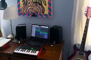 Emelia Pianes music workstation waits ready for her to set to work. Emelia has committed herself to releasing one song each week, adding to her album Quarantunes.
