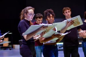 Caroline Taylor, Max Polite, Kennedi Bickham and Eli Hinerfeld sing their parts in an in-person rehearsal for Something Rotten! before school was closed. Only three such rehearsals were able to take place before students were sent home.