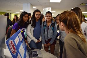 Students gather around a club shopping booth during the 2019-20 school year.