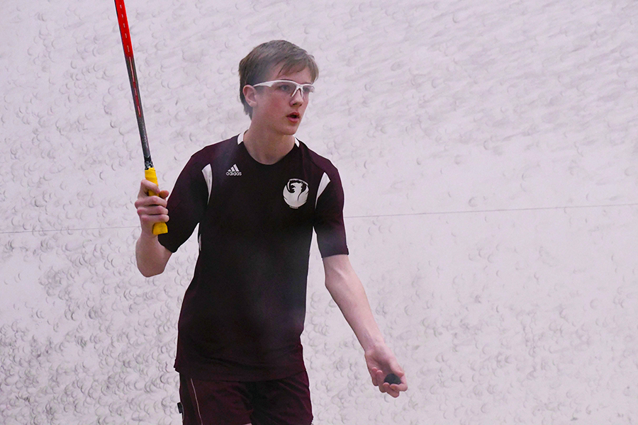 Sophomore William Kraemer plays squash in a competition against the Latin School of Chicago before the novel coronavirus.