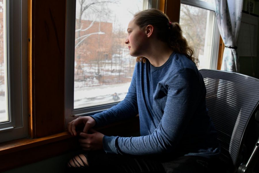 Freshman Elena Bloom gazes out her window awaiting the return to normalcy. While distance learning used to be enjoyable, students long for the days they can escape the monotonous cycle of Zoom classes. 
