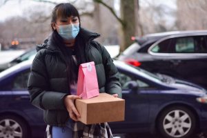 Junior Chloe Ma delivers her baked goods to a customer. 