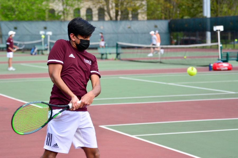 Junior+Sid+Shah+competes+against+Lake+Forest+Academy+on+April+27.+The+boys+tennis+team+advanced+to+state%2C+sending+two+singles+and+two+doubles+teams.+