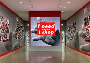 Barbara Kruger’s art exhibit at the Art Institute of Chicago is filled with oversized instillations of text-heavy graphics, photography and visuals. Visitors can walk through the room to observe the surrounding art, composed primarily of contrasting shades of gray and red. 