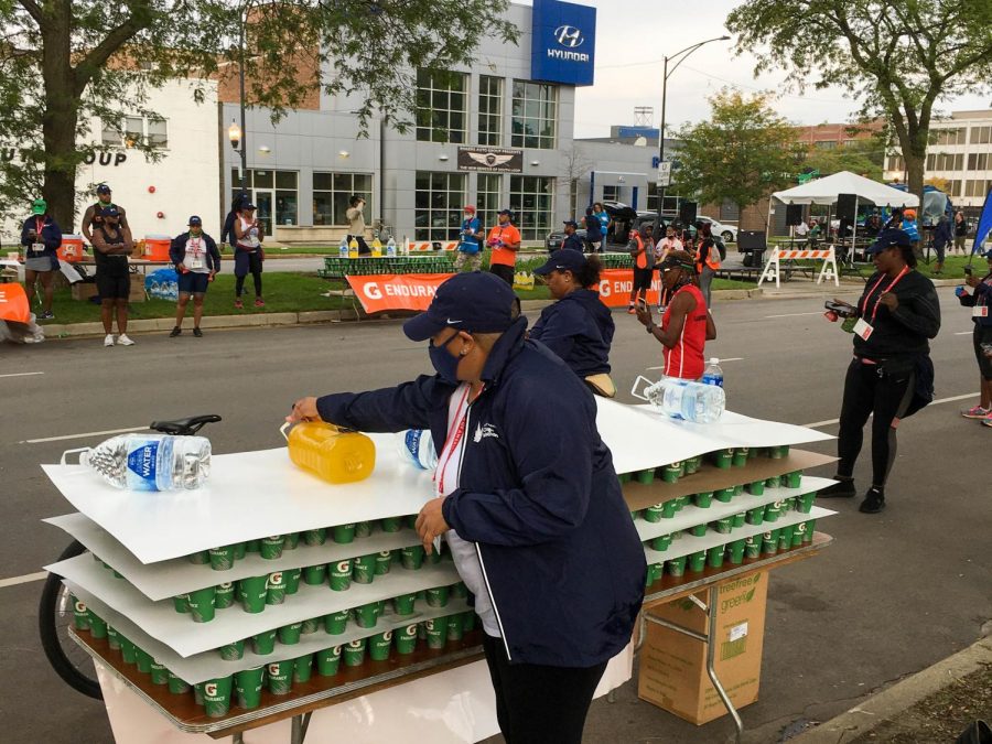 Veteran marathon runner Shauna Anderson decided this year to come volunteer on the course and cheer on runners. She passed out water and orange juice to tired athletes.