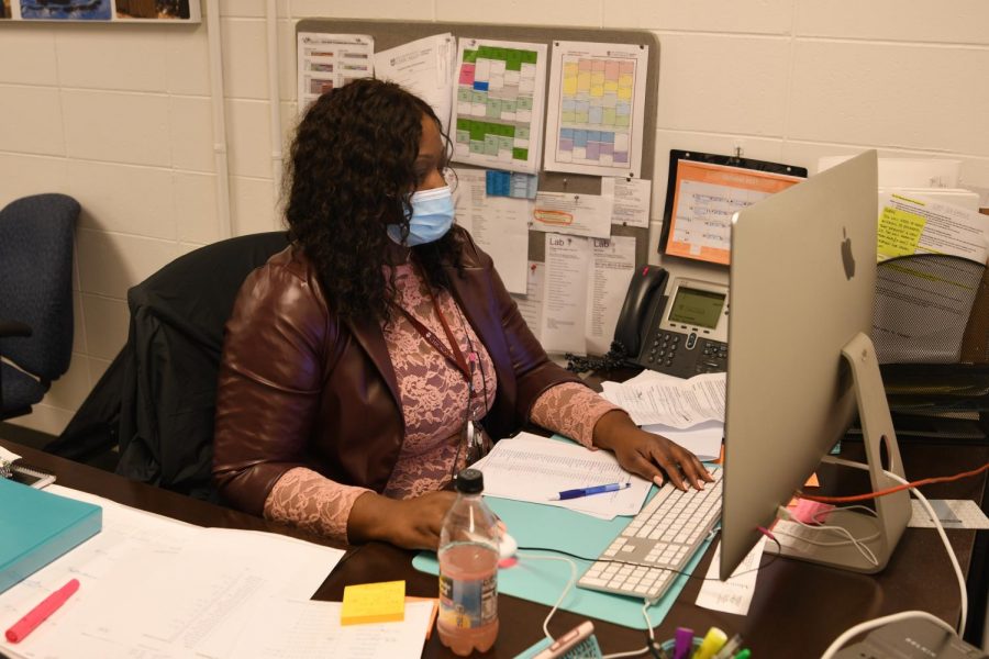 Attendance secretary Robyn Roland completes work. Ms. Roland mainly works with attendance coordinating student absences and events such as field trips.