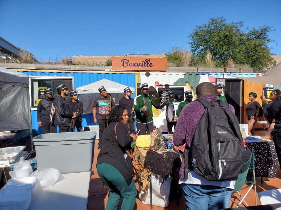Visitors cluster around the center of the plaza to watch the Chicago State University marching band on Oct. 17 during Boxvilles final event of the year.