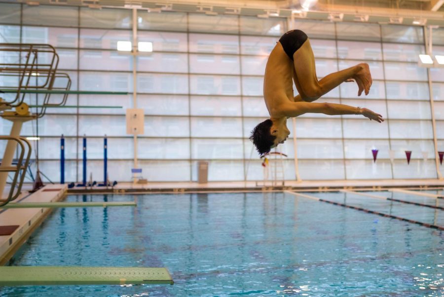 During the diving team’s practice at Gerald Ratner Athletic Center on Dec. 5, senior Ben Luu does a backwards somersault into the pool.