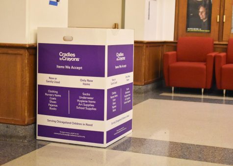 One of the Cradles to Crayons donation boxes sits in the high school lobby. Cradles to Crayons is accepting winter apparel donations for a limited period of time.