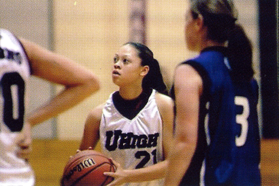 In this image from the 2009 U-Highlights yearbook, Alexis Jenkins, Class of 2009, shoots a free throw during a game. Jenkins, alongside assistant soccer coach Elan Weiner, has returned to coach at U-High. 
