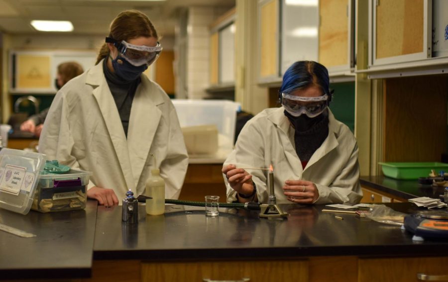 Juniors Amelia Cifu and Zoe Stephens light a Bunsen burner during Science Olympiad practice. The Lab Science Olympiad varsity team took second place overall at an invitational competition held at Marquette High School in Milwaukee, Wisconsin.