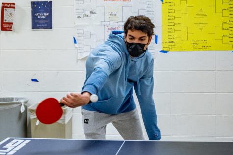 Senior Johnny Patras returns a hit during a ping pong tournament game against Senior Theo Arado. Johnny lost to Theo 12-10 in a win-by-two game. 