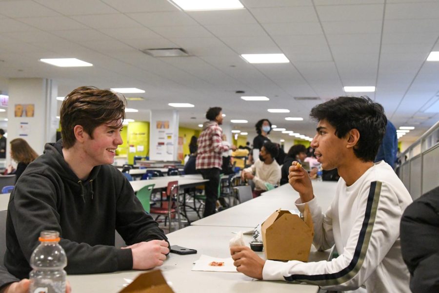 Juniors David Wolf and Sohan Manek eat lunch without masks. After spring break masks will be optional throughout the entire school.