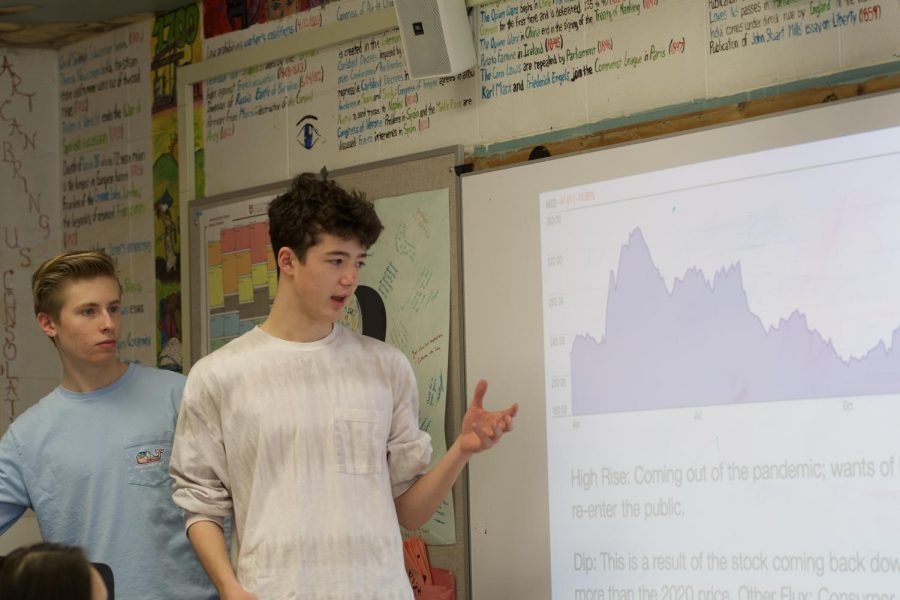 Sophomores Jackson Skelly and Brandon Chang present at a Finance Club meeting April 13.
