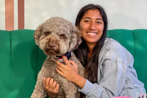 Junior Kriti Sarav poses with her dog, whom she and her family got two weeks before the pandemic hit. According to Kriti and other students, the positive effects their dogs had on them throughout remote learning have continued into the return to in-person activities.