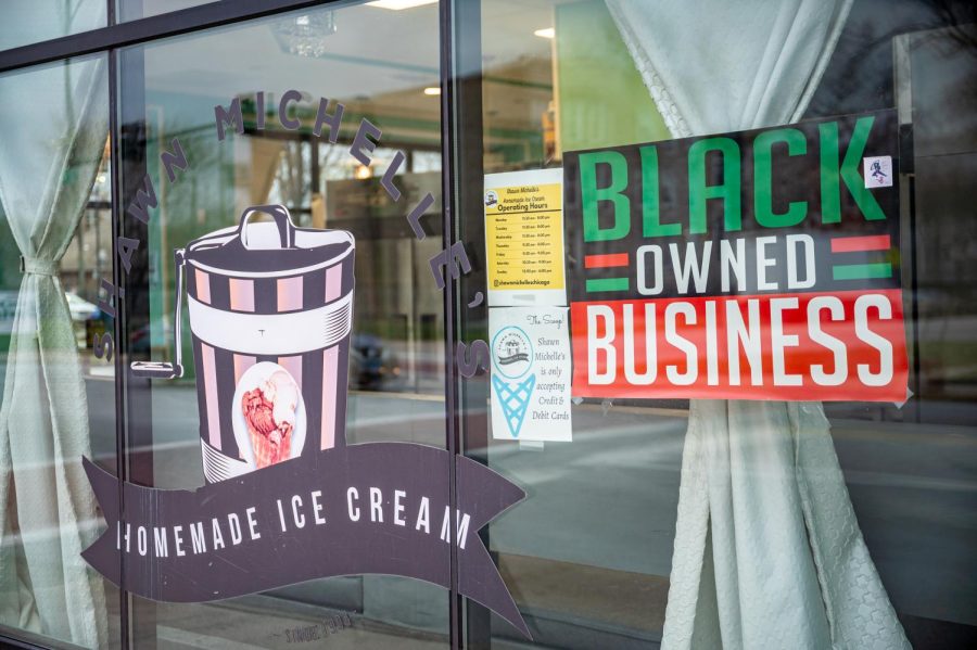 The front of Shawn Michelles features their logo along with a Black owned Business sign.