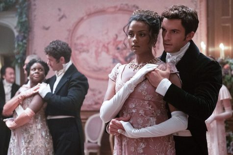 Kate Sharma (played by Simone Ashley) and Anthony Bridgerton (played by Johnathan Baily) dance during an extravagant ball in Season 2, Episode 4 of “Bridgerton.”