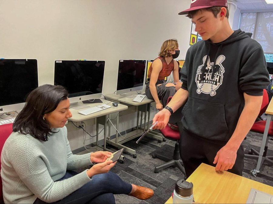 Fatema Burhani converses with her 10th grade advisee Adam Syverson during the long advisory meeting period on Wednesdays. 