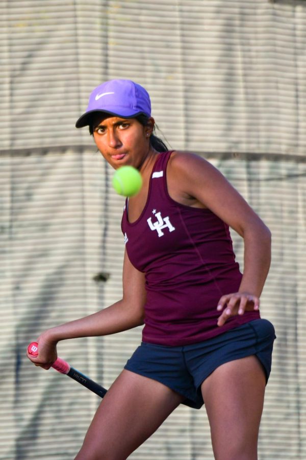 During practice, junior Kriti Sarav hits a forehand shot across the court. This year, the girls tennis team won the 1A IHSA State Championship on Oct. 21-23, and Kriti finished in the elite eight in singles. 