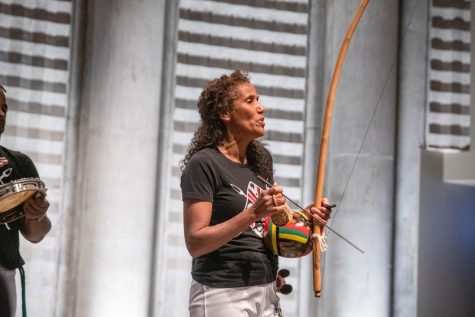 Traditional Tunes. Mestra Marisa of the Afro-Brazilian dance group Gingarte Capoeira demonstrates two traditional Brazilian instruments, the berimbau and caxixi, which are used in the martial art form of capoeira. 