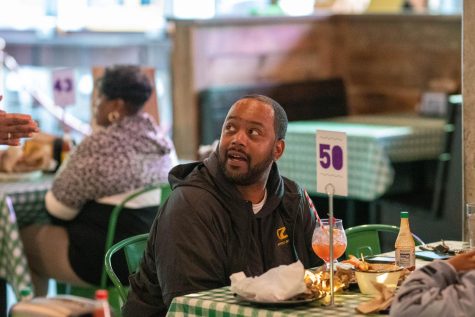 A customer enjoys his food at a table at Daisys Po’ Boy. The resturant, which opened this summer, is an homage to classic New Orleans sandwich cuisine.