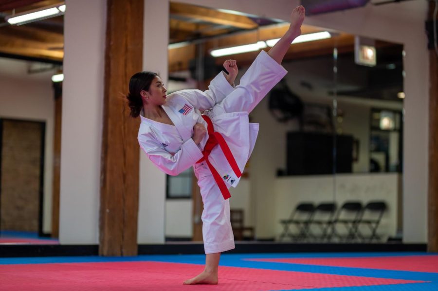 Senior+Maile+Nacu+throws+a+kick+into+the+air.+Maile+trains+in+karate+at+the+top+level+four+to+five+times+a+week.+She+is+a+part+of+her+familys+Enso+Karate+school.+