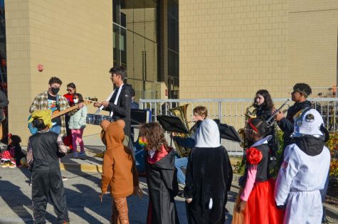 Band returns to perform at traditional Halloween parade for youngest Lab students